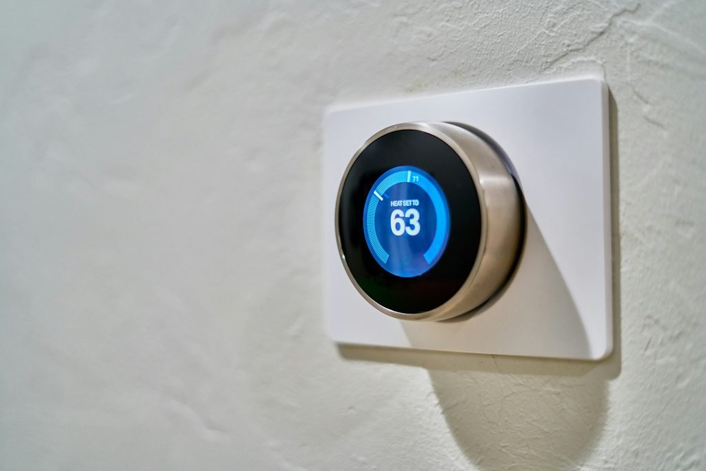 Home thermostat control, representing heating and cooling as the biggest energy use category