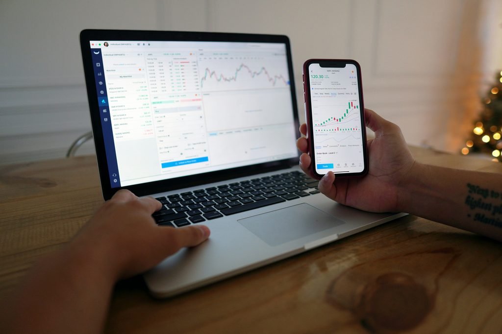 Phone showing a brokerage investing app, representing buying your first index fund