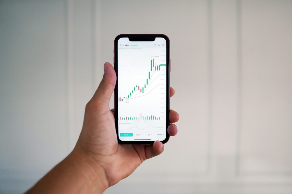 Phone showing a brokerage app, representing opening investment account