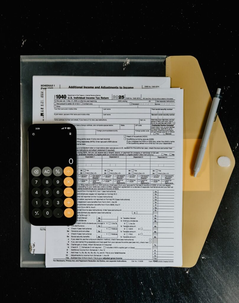 Paycheck and calculator, representing calculating the true-up on your 401k match