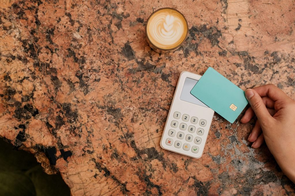 Calculator and credit card, representing calculating real interest savings from negotiation