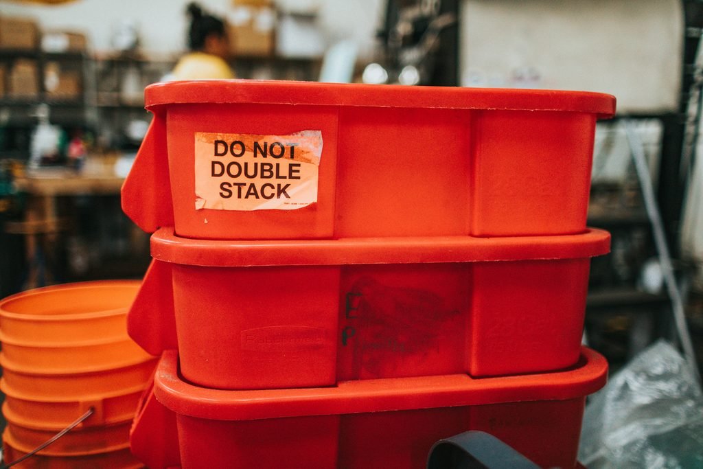 Stacked buckets filling with water, representing how tax brackets fill in layers