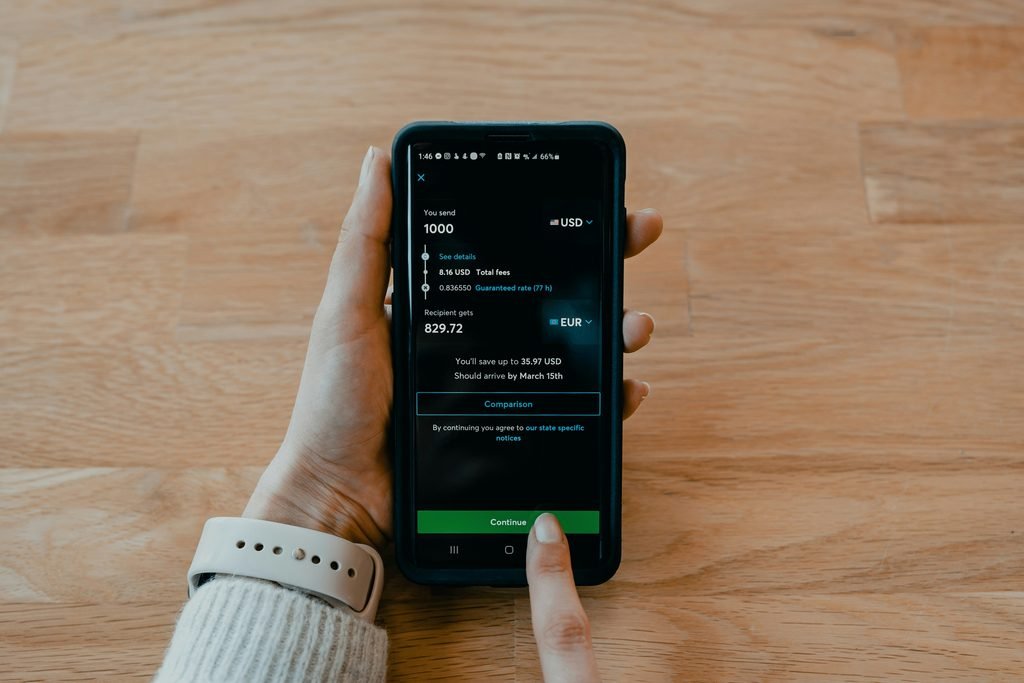 Automatic savings transfer on a banking app, representing paying yourself first