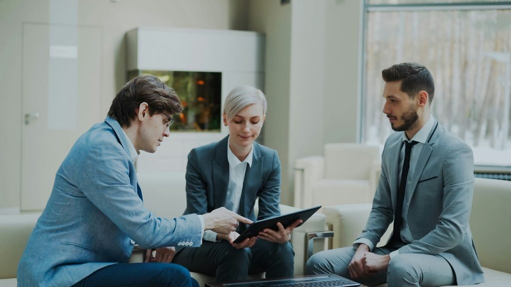 Person meeting with a lender at a bank, representing getting your real down payment number